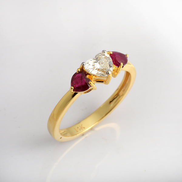 14K yellow gold ruby and diamond three-stone promise ring by Ganpati, featuring a delicate, minimalist design with vibrant gemstones.