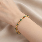 Natural emerald bracelet for women with oval green emeralds and infinity links in 925 sterling silver and 18K gold vermeil.